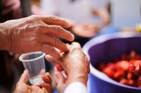 feeding to hand the poor helping  beggar in social. poverty conceptの写真素材