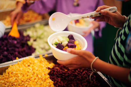 The hands of beggars offer food from the donor : The life of the poor : The concept of feeding