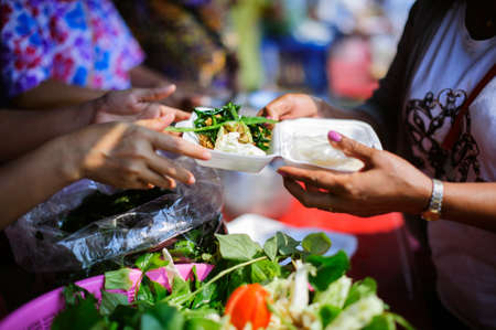 The donation is a hope for hungry people to fight : Volunteers Share Food to the Poor to Relieve Hunger : The concept of sharingの写真素材