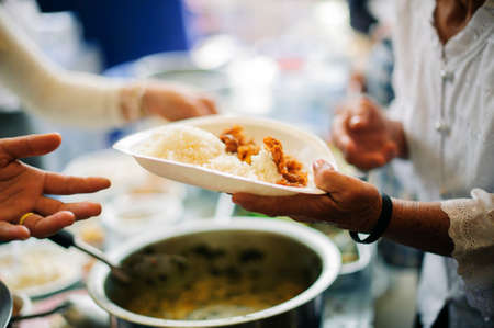 Volunteers Share Food to the Poor : Social Problems of Poverty Helped by Feeding : Concepts problems of life the poorの写真素材