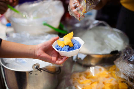 concept of begging food : Beggar begs food from donors : concept of poverty in Asian societyの写真素材