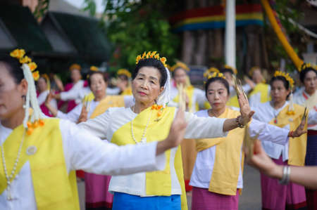 LAMPHUN, THAILAND - MAY 12, 2019 : Dancing woman wearing long nails, dancing in the event Bathing Phra That Chedi Hariphunchai in Lamphun, Thailand.のeditorial素材
