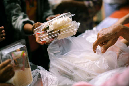 Hunger problems of the poor have been donated food to reduce hunger : the concept of food shortage in the world : Donate Food with Love and Hope to the Poor: The concept of food is essential to lifeの写真素材