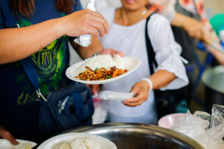 Volunteers Share Food to the Poor : Social Problems of Poverty Helped by Feeding : Concepts problems of life the poorのeditorial素材