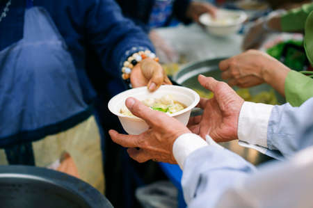 the concept of social sharing : The Hope of the Poor by Donating Charity Food to the Immaculate : Participation in sharing food for the poor : The Concept of Loveの写真素材