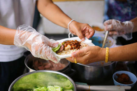 Help serving free food to the poor Needy : concept  Hungerの写真素材