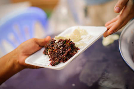 Help serving free food to the poor Needy : concept Sharing Food With Homelessの写真素材