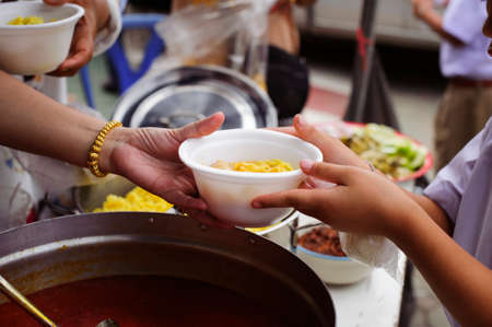 concept Tackling Hunger and Food : Donate food to the poor and the poor who suffer from starvationの写真素材