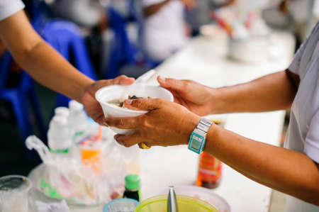 The Concept of Donating Food to the Poor in Society : concepts of poverty in Asianの写真素材