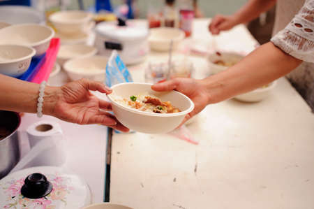 concept of poverty in Asian society : Charity food is free for people in slumsの写真素材