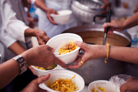 concepts of poverty in Asian society : Volunteers Share Food to the Poor to Relieve Hungerの写真素材