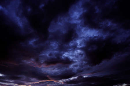 Black clouds float in the sky in the evening