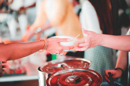 Warm food for the poor and homeless: the concept of giving to helpの写真素材