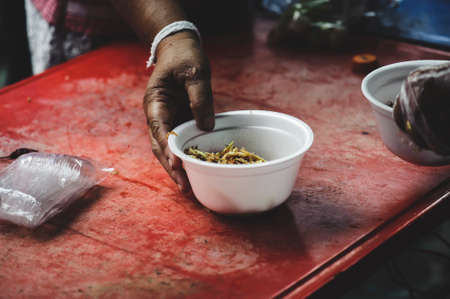 Volunteers serving food for poor people : concept of free food servingの写真素材
