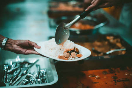 Philanthropists donate food and help the poor : concept of feeding