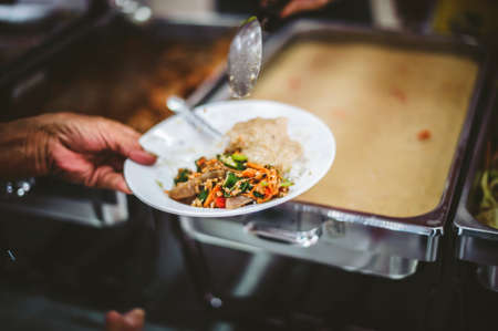 Compassion in human society leads to free food donations to the poor: poor people still need food, concept of feeding to the poorの写真素材