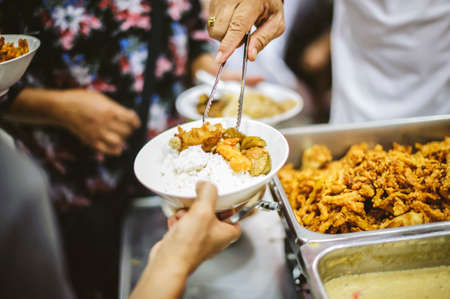 Hungry People Reach Out to Charity: Charity-giving donations to the needyの写真素材