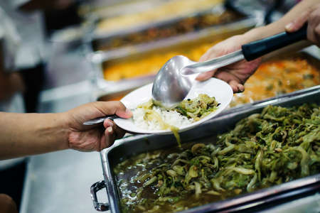 The concept of food needs, food shortages: free food distribution to the poor, food aid in human societyの写真素材