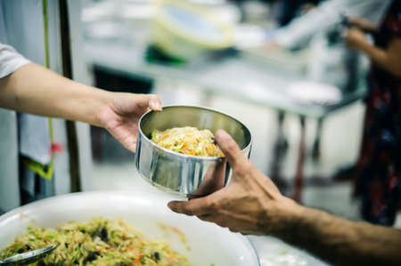 Hungry People Reach Out to Charity: Charity-giving donations to the needyの写真素材