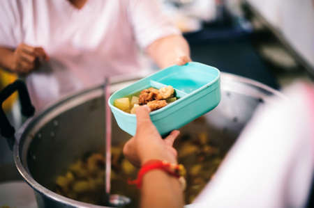 Food donation to needy, needy: providing food to needy people who need help.の写真素材
