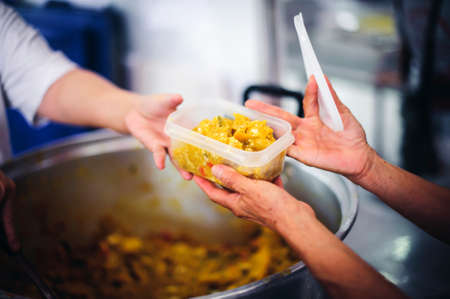 The poor are cared for by generous donations: the concept of food aidの写真素材