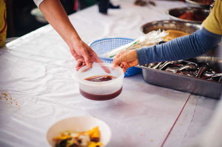 The concept of hunger: Volunteers draw food to donate to hungry people with concern.