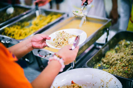 Food sharing to help the homeless : the concept of food needs to alleviate hungerの写真素材