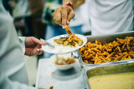 Food donation to needy, needy: providing food to needy people who need help.の写真素材