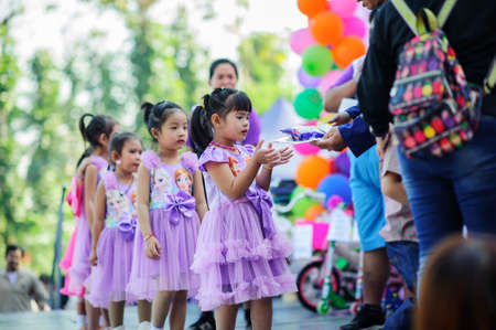 Chiang Mai, Thailand - JANUARY 11, 2020: Energetic Thai children join National Children's Day activities, receiving many prizes Including receiving food and beverages in Saraphi, Chiang Maiのeditorial素材