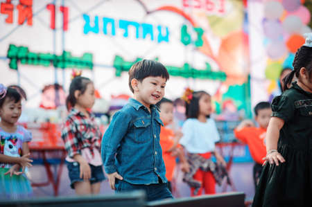 Chiang Mai, Thailand - JANUARY 11, 2020: Energetic Thai children join National Children's Day activities, receiving many prizes Including receiving food and beverages in Saraphi, Chiang Maiのeditorial素材