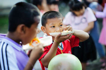 Chiang Mai, Thailand - JANUARY 11, 2020: Energetic Thai children join National Children's Day activities, receiving many prizes Including receiving food and beverages in Saraphi, Chiang Maiのeditorial素材