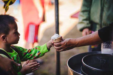 Chiang Mai, Thailand - JANUARY 11, 2020: Energetic Thai children join National Children's Day activities, receiving many prizes Including receiving food and beverages in Saraphi, Chiang Maiのeditorial素材