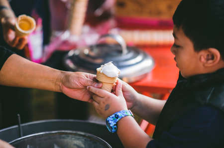 Chiang Mai, Thailand - JANUARY 11, 2020: Energetic Thai children join National Children's Day activities, receiving many prizes Including receiving food and beverages in Saraphi, Chiang Maiのeditorial素材