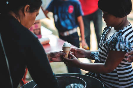 Chiang Mai, Thailand - JANUARY 11, 2020: Energetic Thai children join National Children's Day activities, receiving many prizes Including receiving food and beverages in Saraphi, Chiang Maiのeditorial素材