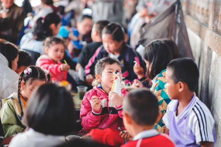 Chiang Mai, Thailand - JANUARY 11, 2020: Energetic Thai children join National Children's Day activities, receiving many prizes Including receiving food and beverages in Saraphi, Chiang Maiのeditorial素材