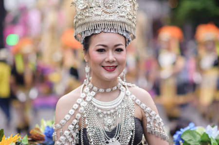 CHIANG MAI, THAILAND - FEBRUARY 08, 2020: Traditionally dressed woman in procession on Chiang Mai 44th Flower Festival in Chiang Mai, Thailand;のeditorial素材