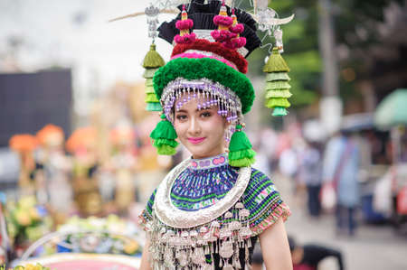 CHIANG MAI, THAILAND - FEBRUARY 08, 2020: Traditionally dressed woman in procession on Chiang Mai 44th Flower Festival in Chiang Mai, Thailand;のeditorial素材