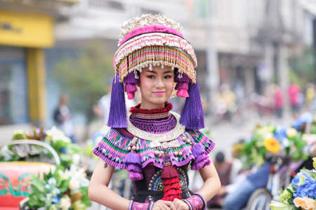 CHIANG MAI, THAILAND - FEBRUARY 08, 2020: Traditionally dressed woman in procession on Chiang Mai 44th Flower Festival in Chiang Mai, Thailand;のeditorial素材