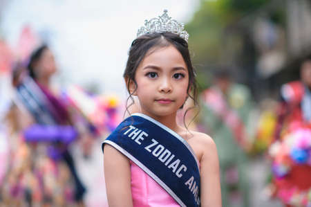 CHIANG MAI, THAILAND - FEBRUARY 08, 2020: Little girl dressed in beautiful clothes in a parade at the 44th flower festival parade in Chiang Mai, Thailandのeditorial素材