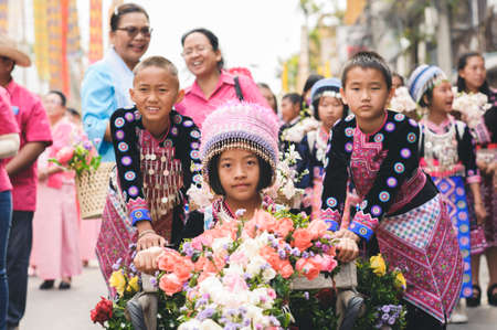 CHIANG MAI, THAILAND - FEBRUARY 08, 2020: Group of children dressed in traditional clothes at the 44th flower festival parade in Chiang Mai, Thailandのeditorial素材