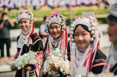 CHIANG MAI, THAILAND - FEBRUARY 08, 2020: Young men and women dressed in traditional clothe in the...