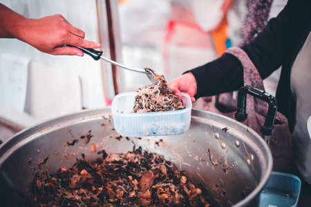 The concept of helping by providing food to the needy in the community.