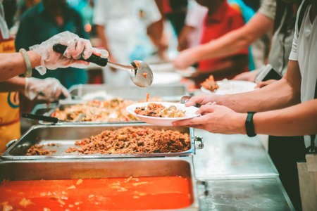 Food donation to relieve hunger. The concept of povertyの写真素材