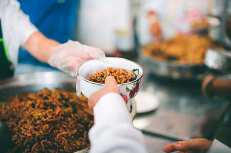 Concept of free food serving : Starvation issues help with food donationsの写真素材
