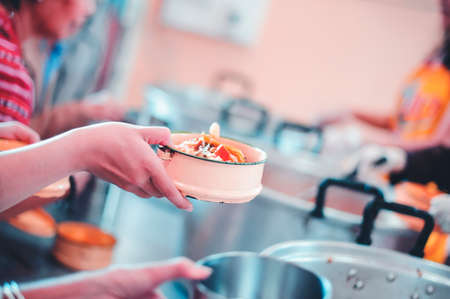 Food donated to hungry people homeless : concept of givingの写真素材