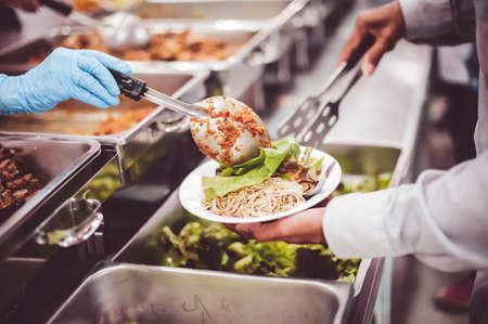 Food donated to hungry people homeless : concept of givingの写真素材