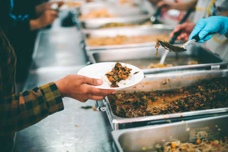 Concept of feeding : Sharing food with people in poor communitiesの写真素材