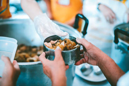 Donate food to the poor : Poverty concept