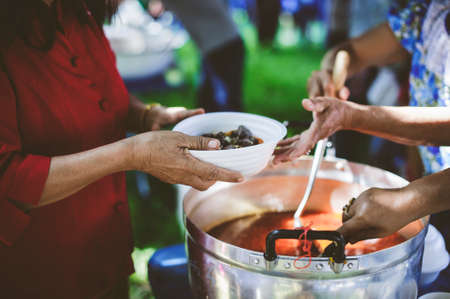 Donate food to the poor : Poverty conceptの写真素材