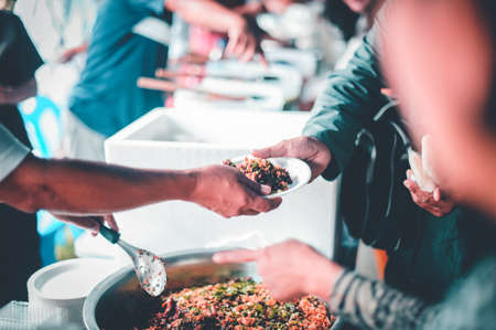 Receiving food for the poor from volunteers : Concepts of povertyの写真素材